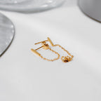 Pair of 18K gold vermeil bar chain-link stud earrings displayed over a white card, chains hanging.