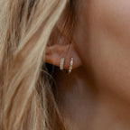 8mm huggie hoop earrings in 18K gold vermeil and 925 sterling silver featuring baguette cubic zirconia and pearl detail, hypoallergenic tarnish-resistant small snap closure hoops for sensitive ears.