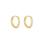 Pair of Tink huggie hoops in 18K gold vermeil set with cubic zirconia.