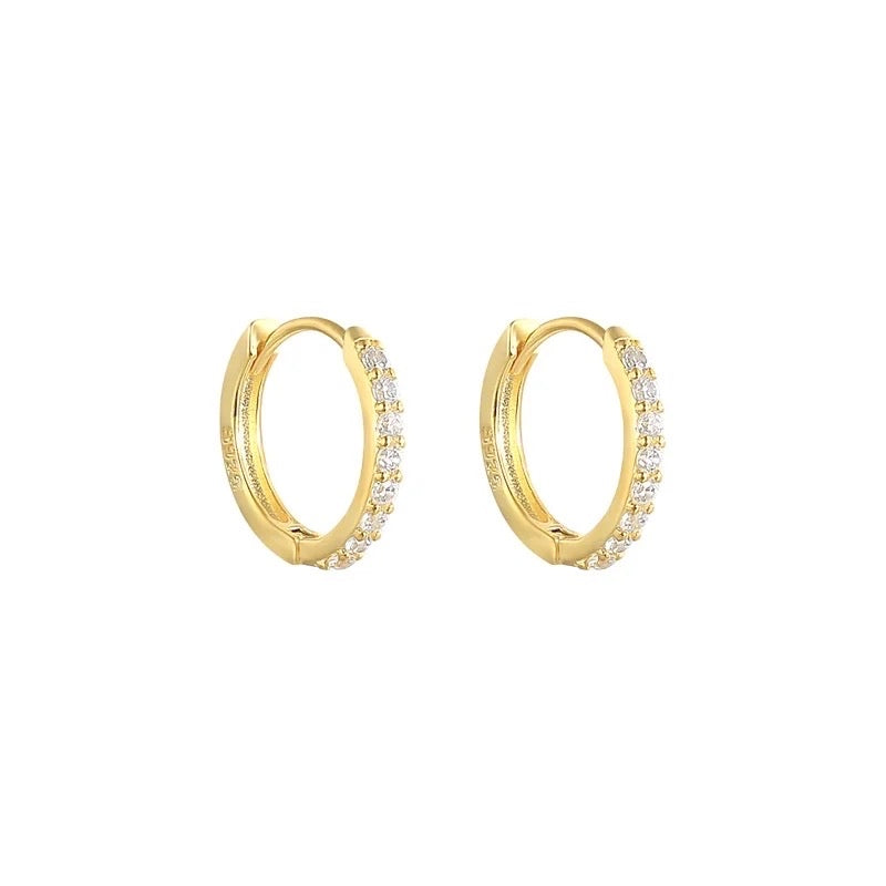 Pair of Tink huggie hoops in 18K gold vermeil set with cubic zirconia.