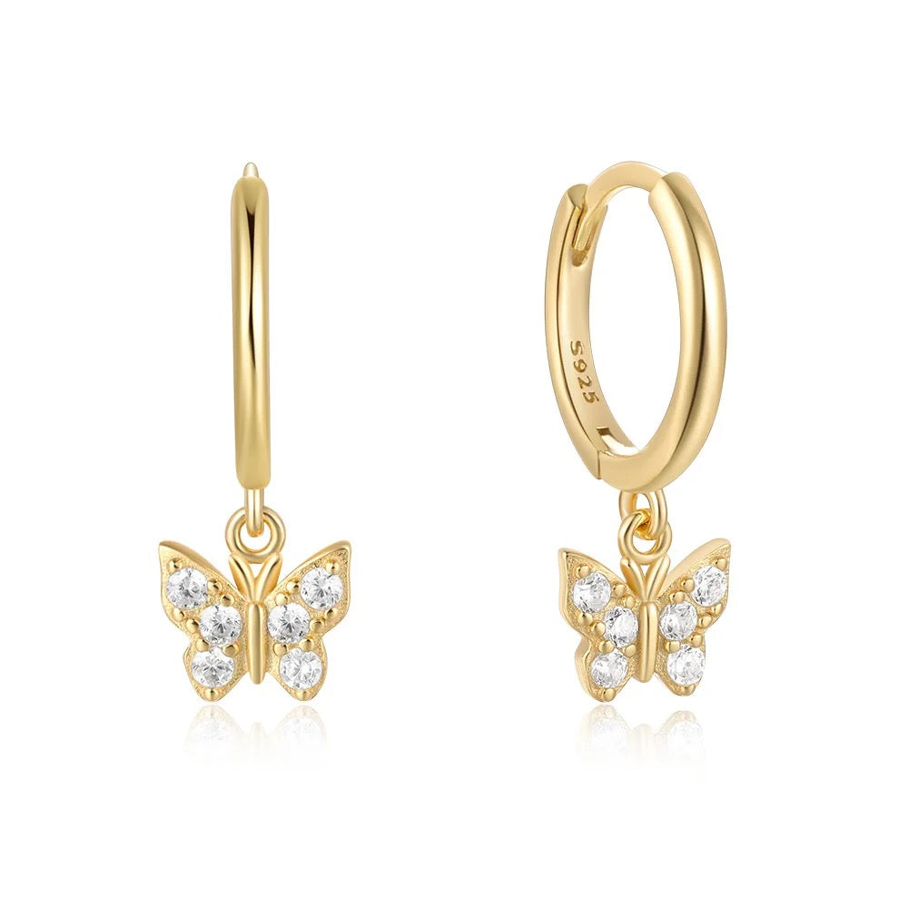 Butterfly huggie hoop earrings in 18K gold vermeil with a small butterfly charm.