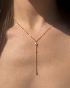 Lariat pearl necklace in gold filled with a natural freshwater pearl drop.
