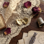 Vintage Heart locket open, showing the two photo windows inside.