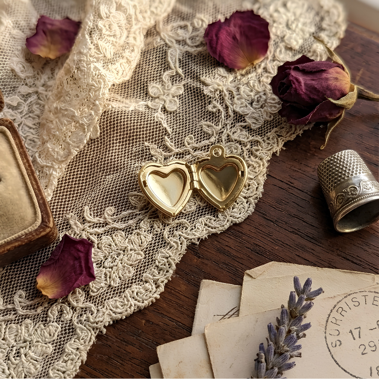 Vintage Heart locket open, showing the two photo windows inside.