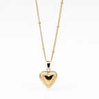 Vintage Heart locket with engraved detailing on a satellite chain.