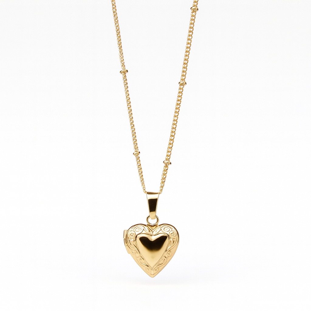 Vintage Heart locket with engraved detailing on a satellite chain.