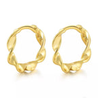 Pair of Wave huggie hoops in 18K gold vermeil with a twisted design.
